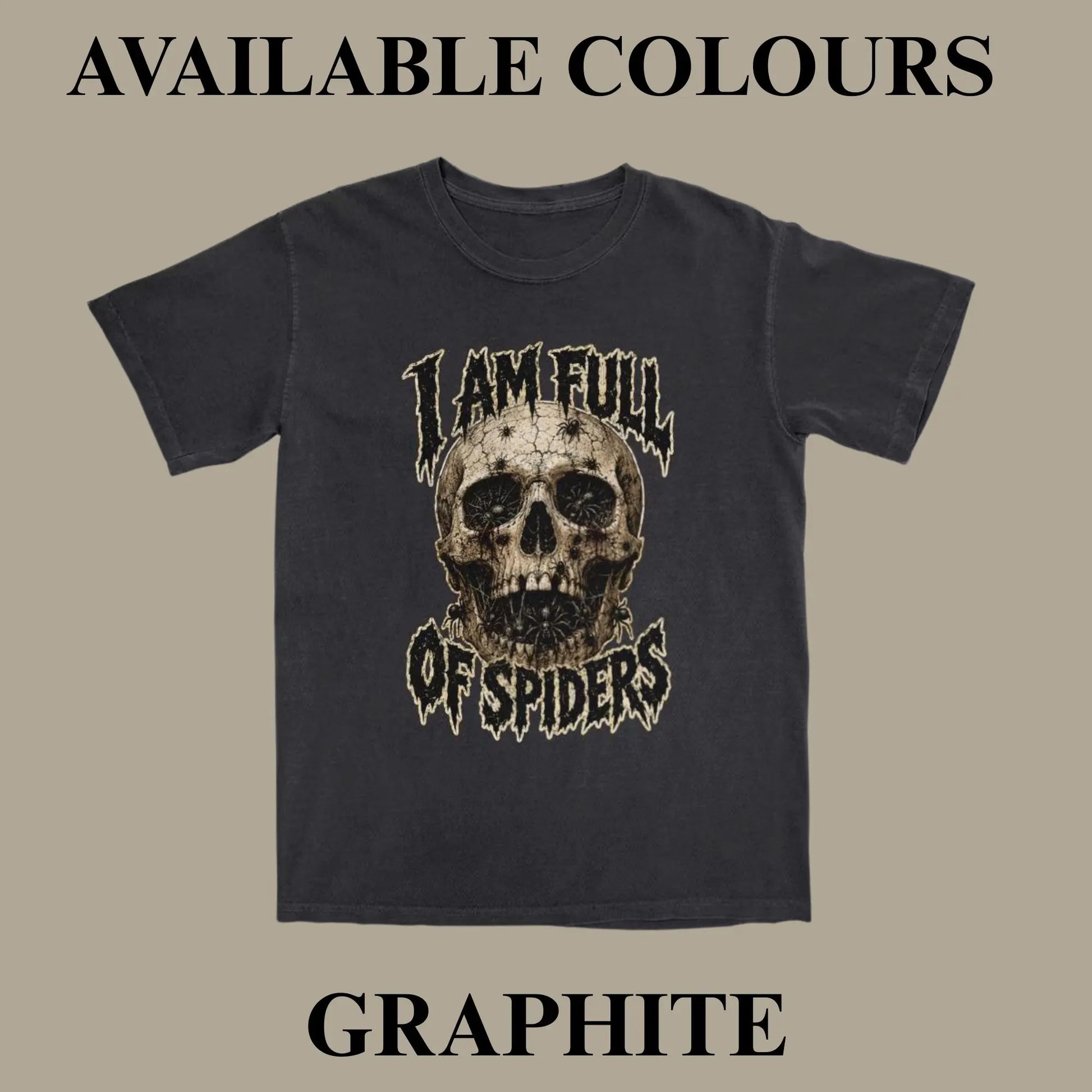 A dark charcoal gray t-shirt with a distressed graphic of a skull and the text 'I AM FULL OF SPIDERS' on the front, displayed against a solid taupe background with 'AVAILABLE COLOURS' and 'GRAPHITE' text overlays.