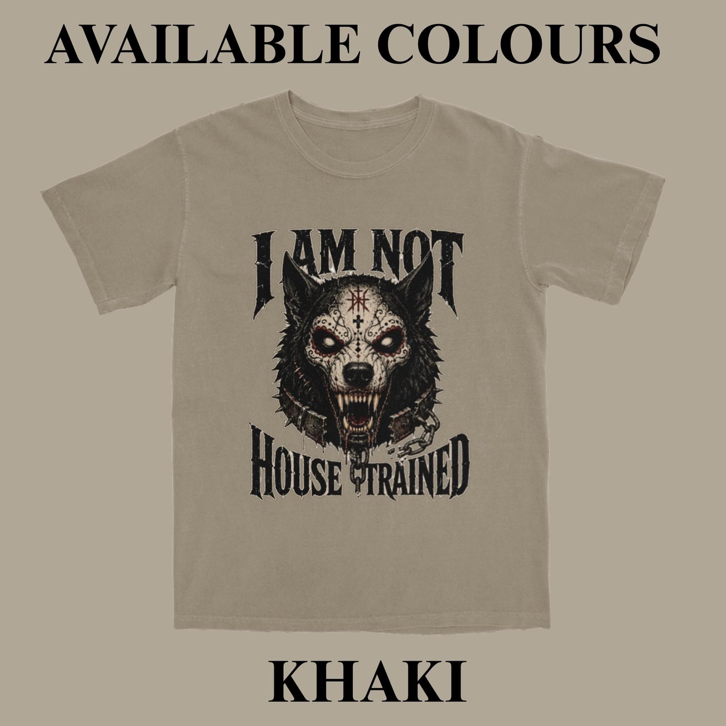 A khaki t-shirt with a black graphic of a snarling wolf and the text 'I AM NOT HOUSE TRAINED'. The image includes text overlays reading 'AVAILABLE COLOURS' at the top and 'KHAKI' at the bottom, set against a solid taupe background.