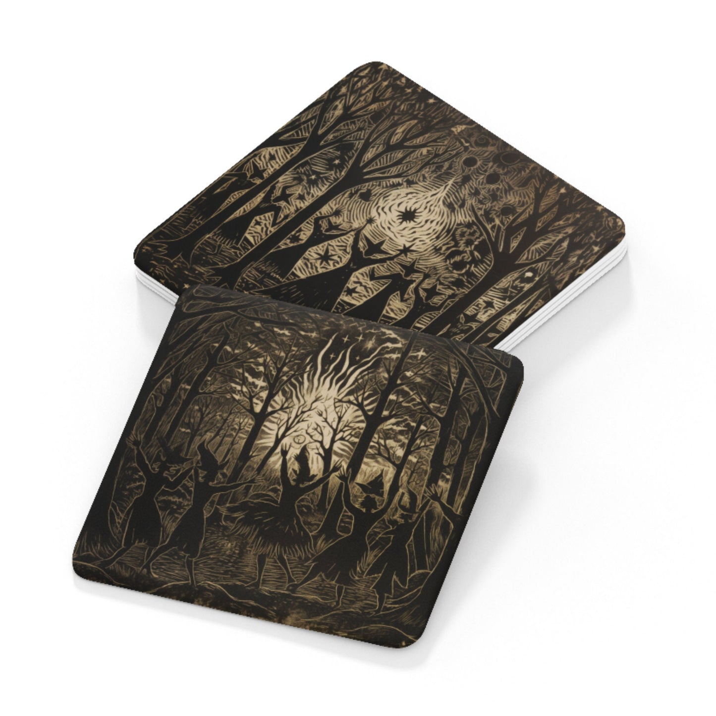 Dark-themed coasters with rustic etchings of witches dancing around a fire, inspired by traditional folklore.