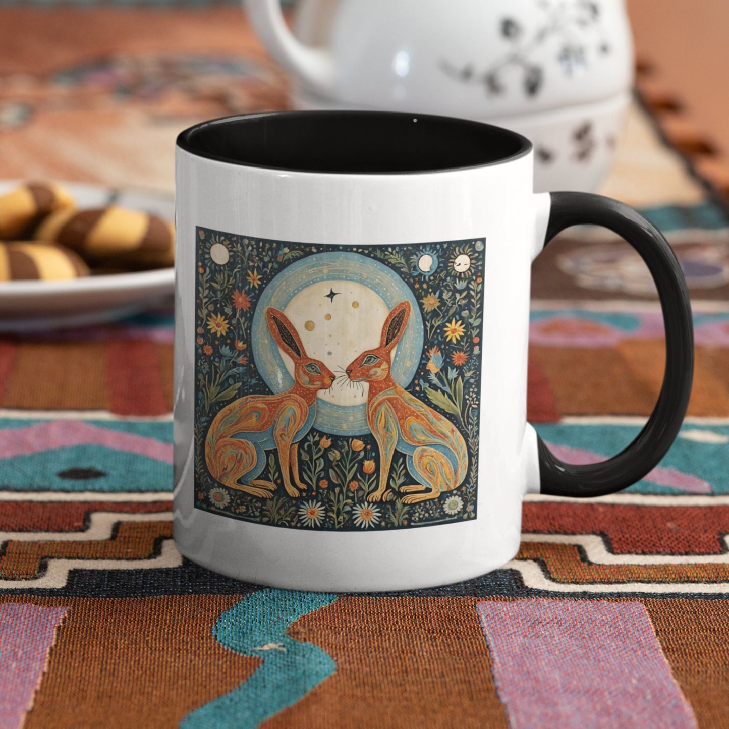 elegant ceramic mug featuring two intricately designed hares under a celestial moon, surrounded by floral patterns and cosmic symbols