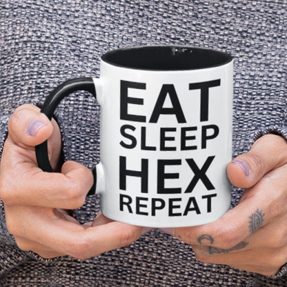 Spellbinding mug with black accents, perfect for morning brews and magical rituals, &#39;EAT SLEEP HEX REPEAT&#39; text.