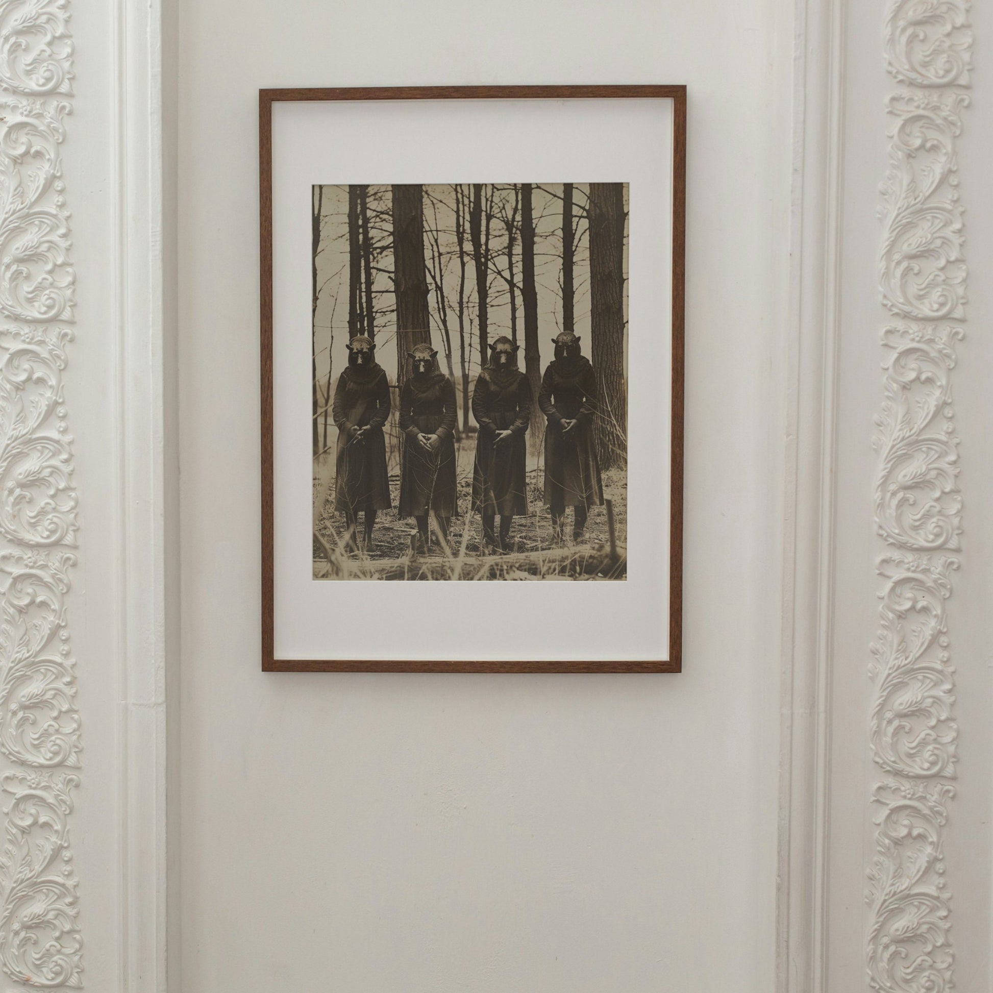 A chilling photograph of four robed figures with animal masks in a barren forest, reminiscent of an ancient ritual.