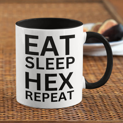 Mystical ceramic mug with &#39;EAT SLEEP HEX REPEAT&#39; slogan, designed for Wiccans and lovers of witchcraft.