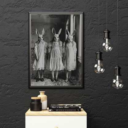 Vintage-style photograph of a bizarre scene with three masked children dressed in Victorian attire, representing a rabbit cult.