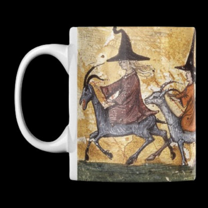 11 oz ceramic mug with a borderless wraparound design featuring a medieval manuscript-style image of witches riding goats. The vintage, mystical artwork is perfect for lovers of witchcraft, folklore, and gothic aesthetics.