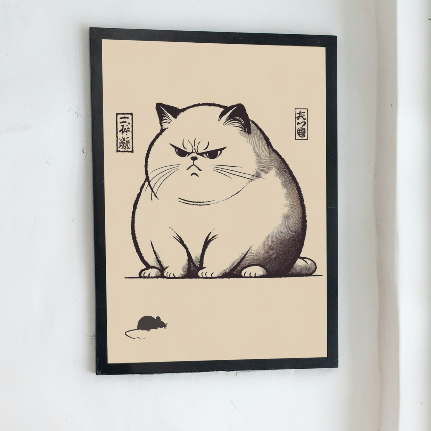 Japanese style unimpressed cat print displayed on a light-coloured wall in a minimalist living room setting.