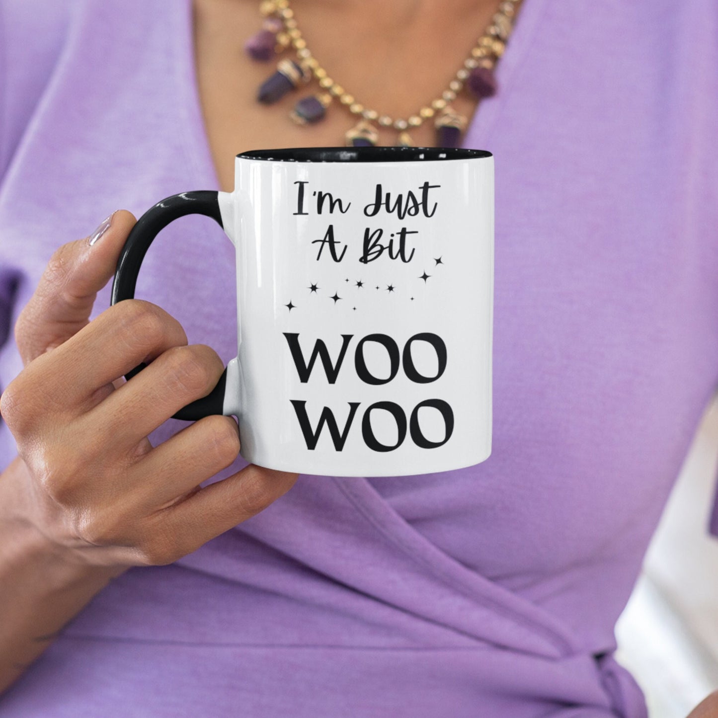 Two toned black and white 11oz ceramic mug with the wording I&#39;m just a bit woo woo, There are a few simple stars to add to the asthetics. A great witchy gift.