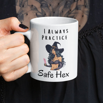 Funny witchy gift. 11oz ceramic white mug with a sexy image of a witch, the witch is holding a condom and the text says I always practice safe HEX.