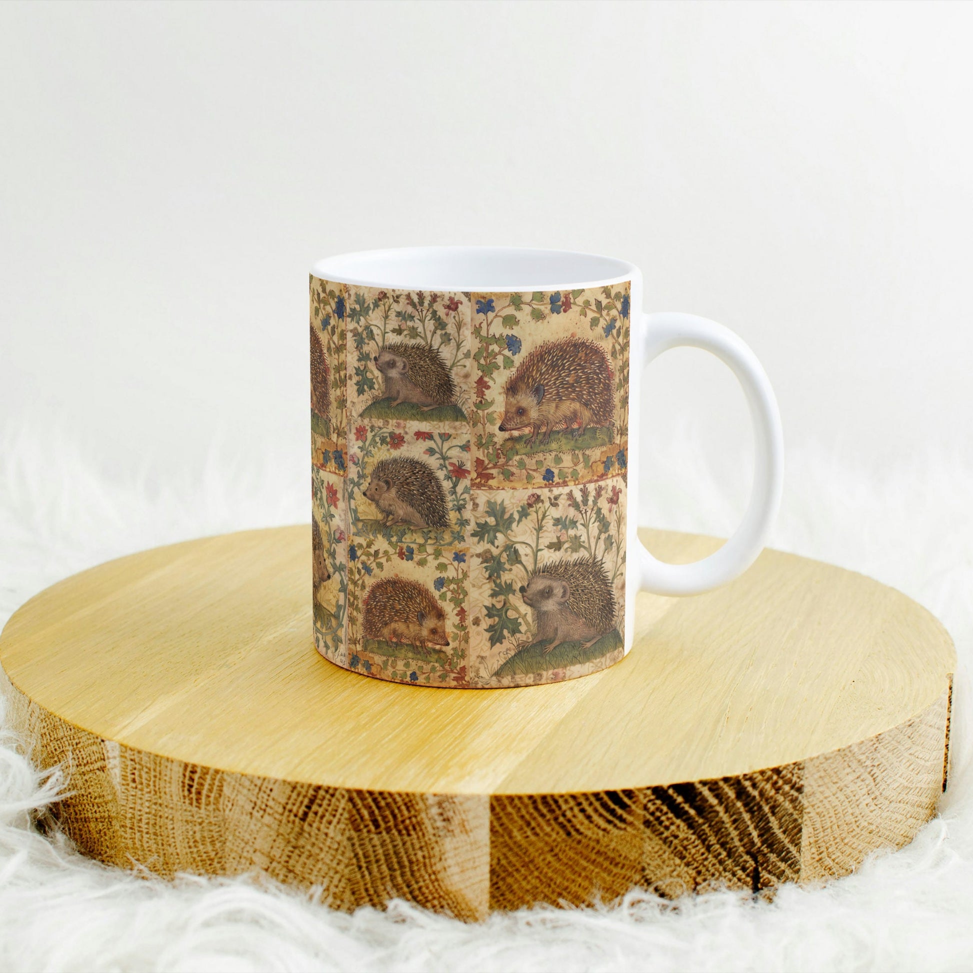Hedgehog-themed mug with intricate floral designs inspired by medieval art