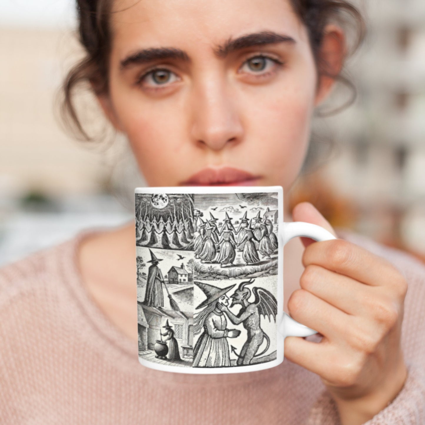 The wraparound design includes a variety of meticulously crafted woodcut images of witches, capturing the essence of early 17th-century illustrations.
