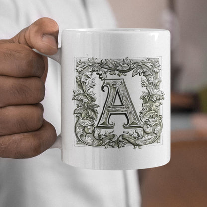 Classic white mug displaying a sophisticated letter rendered in the style of medieval manuscripts, perfect for those who appreciate vintage design