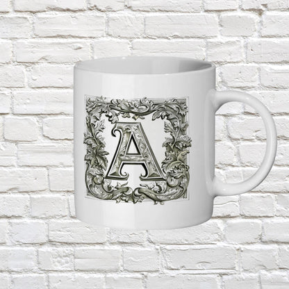 11 oz ceramic mug showcasing a stylized monogram with detailed flourishes, inspired by Renaissance-era illuminated lettering.