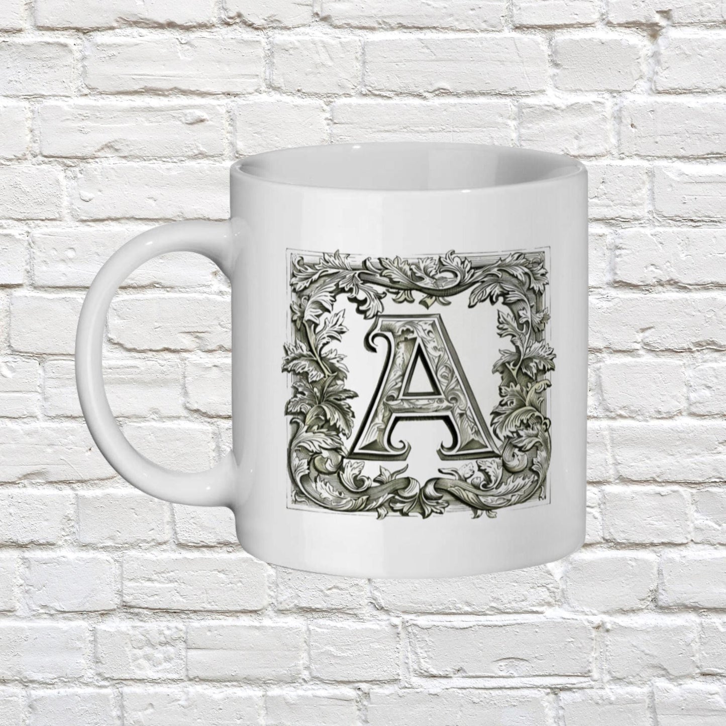 Initial name mug. An artistic mug that presents an initial letter of your choice in an ornate, manuscript-like style, reminiscent of antique book designs