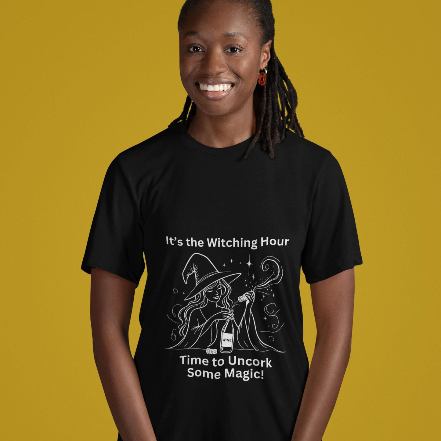 Unisex black t-shirt featuring a witch uncorking a bottle of wine, perfect for wine enthusiasts and Halloween lovers alike