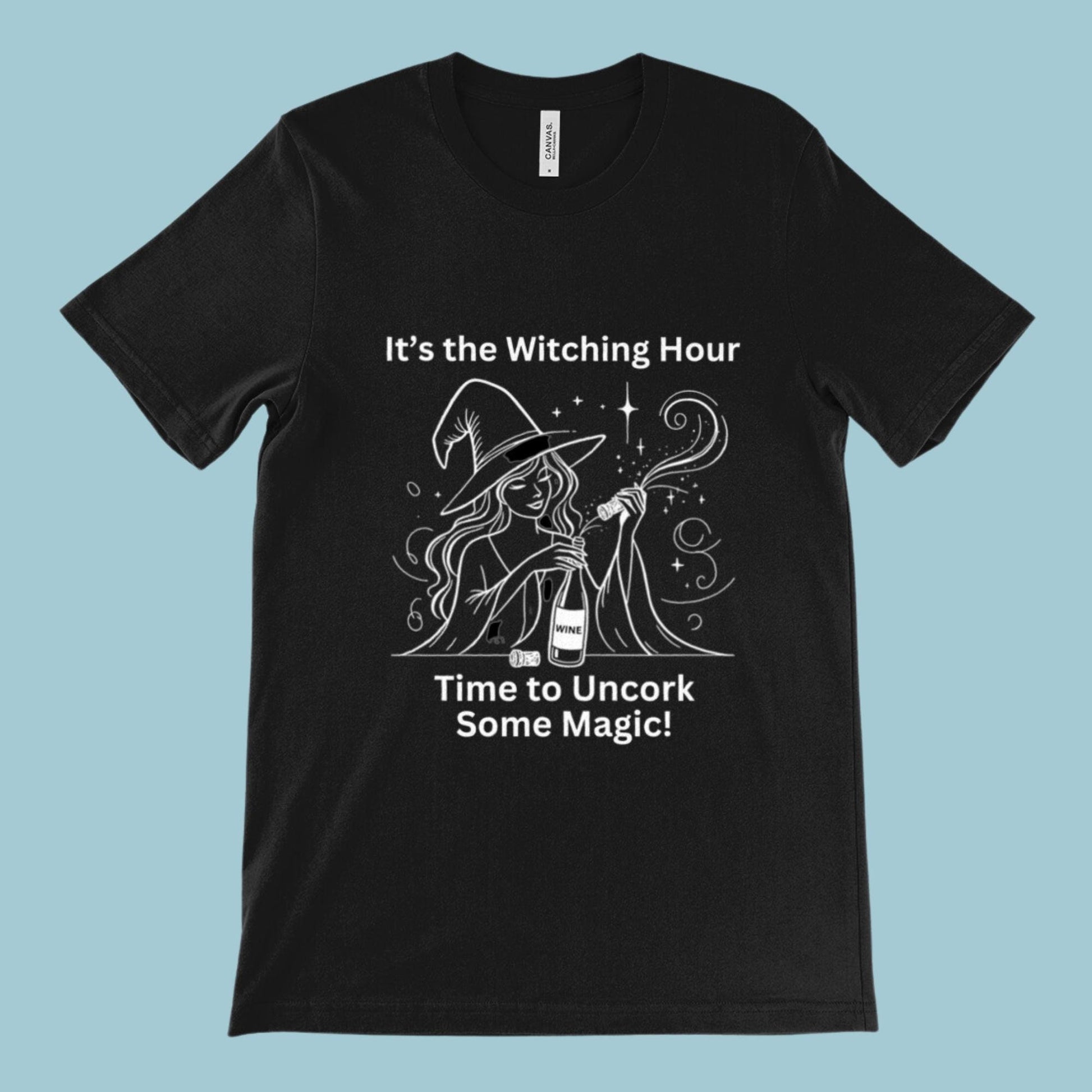 Black unisex t-shirt featuring a witch opening a bottle of wine with the slogan &quot;It&#39;s the witching hour - time to uncork some magic.&quot; Perfect for fans of witchcraft, Wicca, Paganism, or wine lovers.