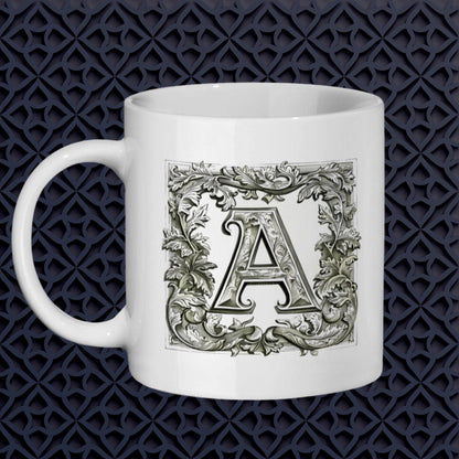 A white 11 oz mug featuring any ornate letter of your choice framed with intricate floral patterns. Monogram mug