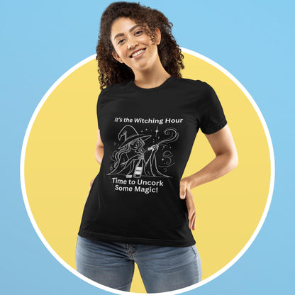 nchanting black t-shirt for wine lovers and witches, with a playful illustration of a witch uncorking some magic