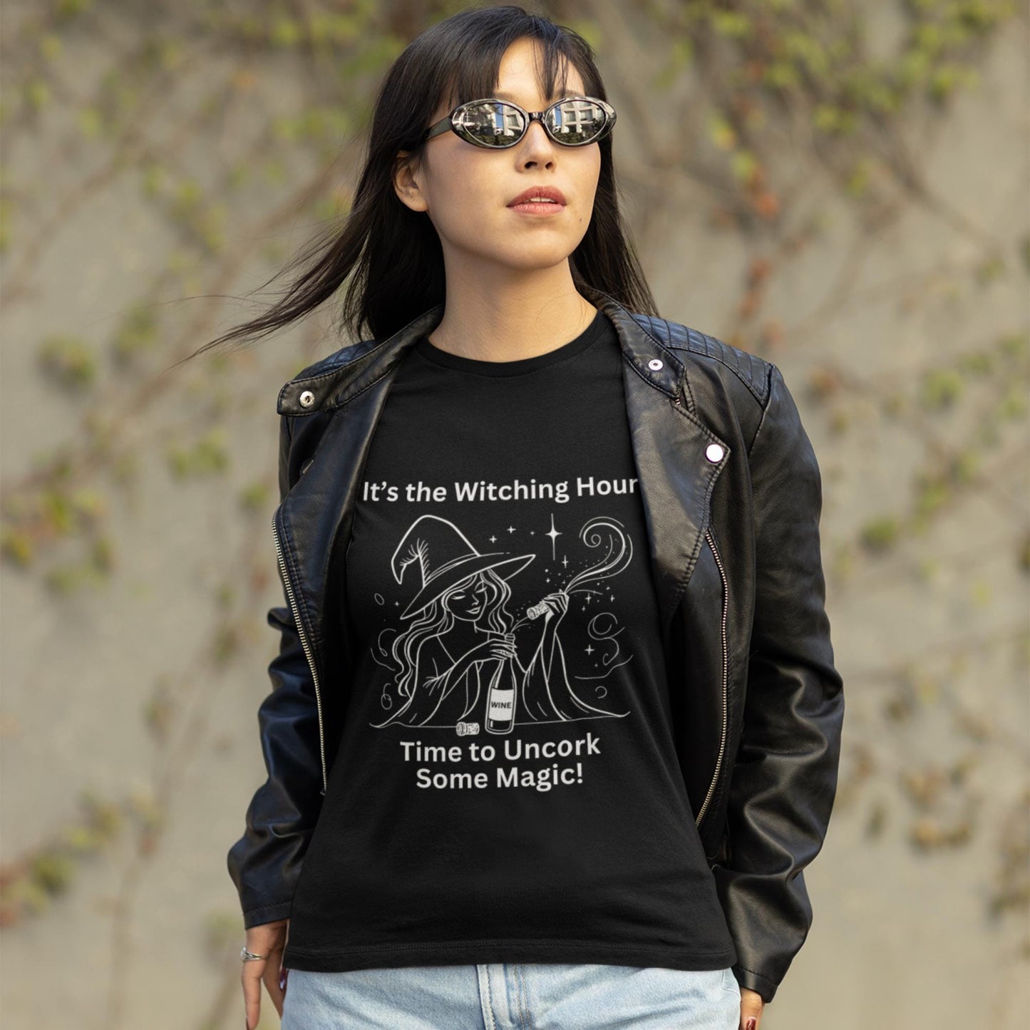 Fun and stylish black tee featuring a witch and wine bottle, designed for those who enjoy both magic and a good drink