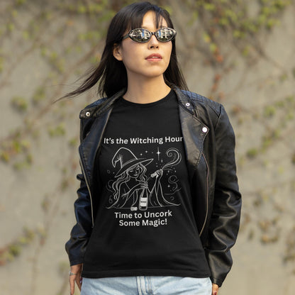 Fun and stylish black tee featuring a witch and wine bottle, designed for those who enjoy both magic and a good drink