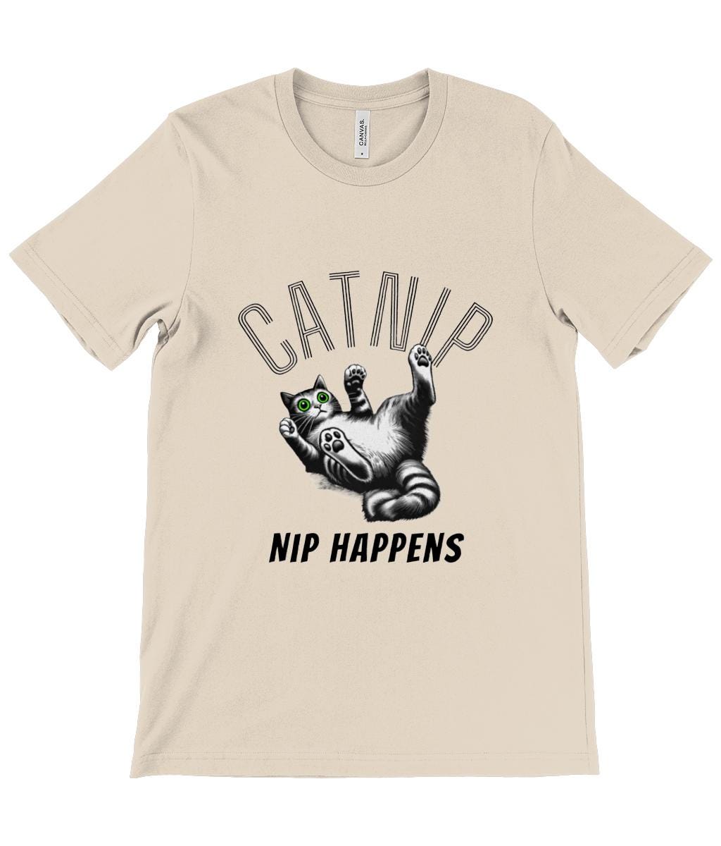 This playful and quirky cat-themed t-shirt is perfect for cat lovers with a sense of humour. Featuring a bold, eye-catching design with the word &quot;CATNIP&quot; in stylized letters, this shirt showcases an adorable cartoon cat with bright green eyes