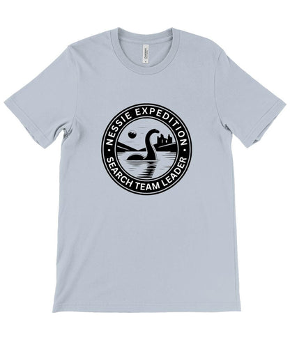 Loch Ness Monster Emblem T-Shirt - A bold design showcasing the legendary Nessie emerging from the lake, with a mysterious castle silhouette and night time scene.