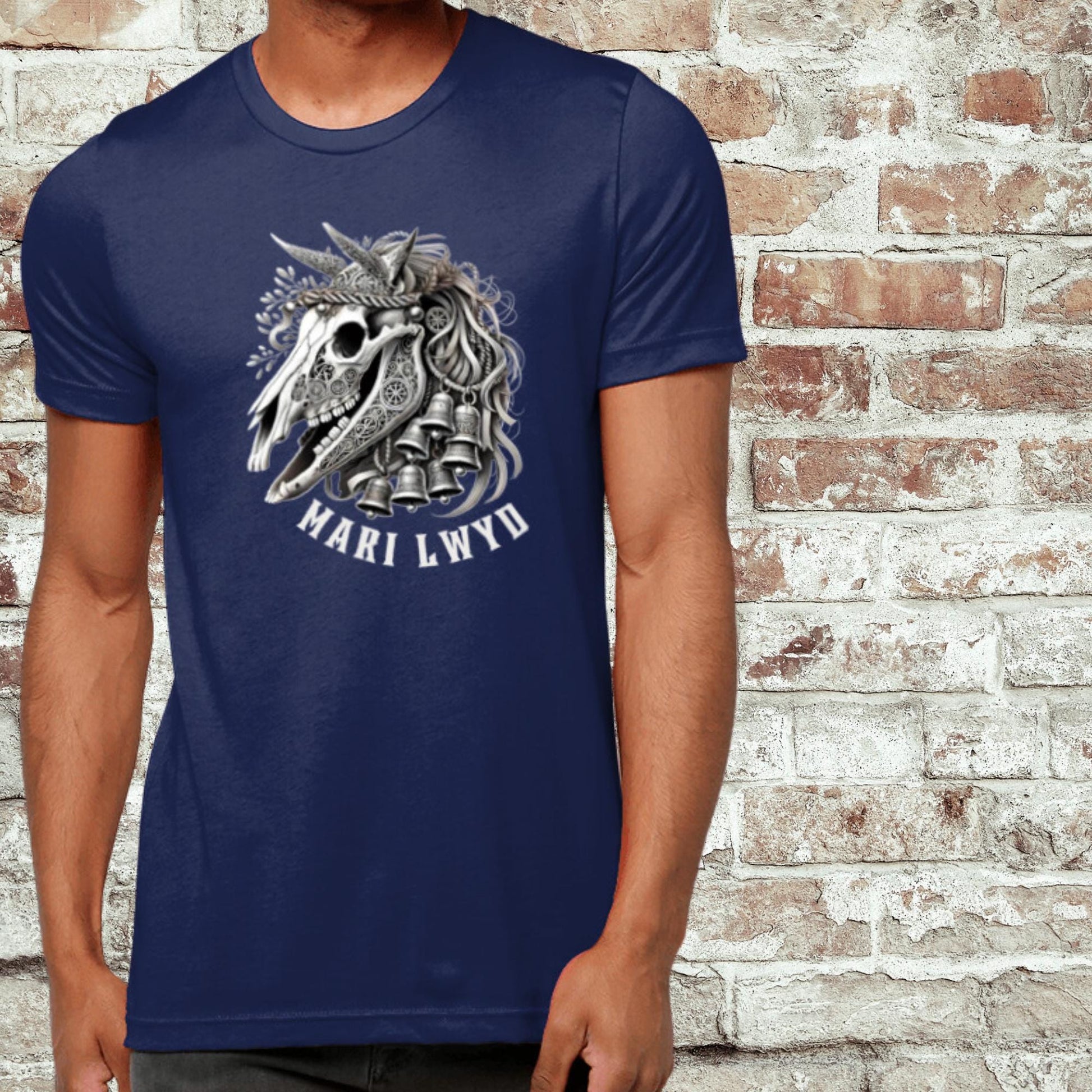 Intricate Mari Lwyd horse skull graphic tee adorned with holiday bells and ribbons, rooted in Welsh folklore. Available in black, teal, navy, or forest green, and sizes XS to 2XL