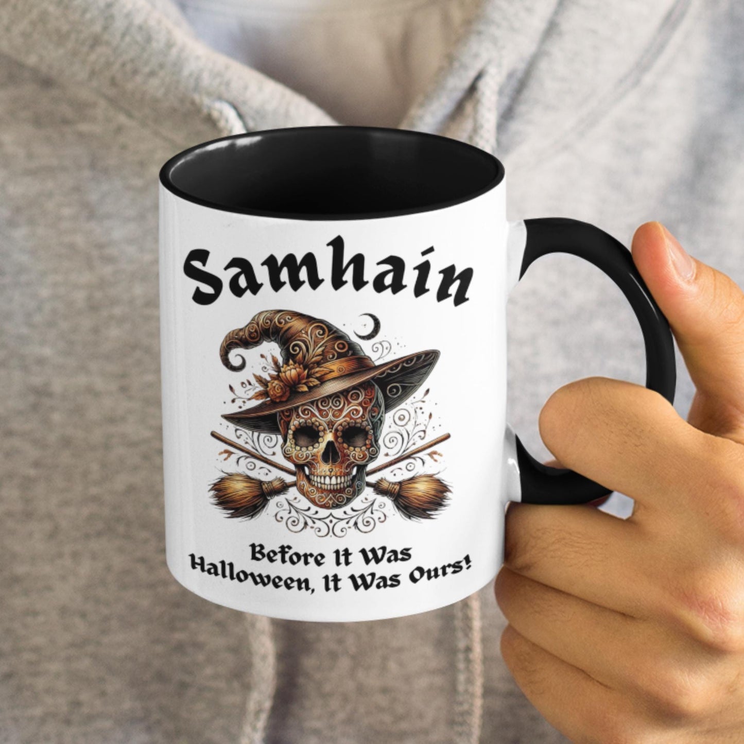 Samhain mug featuring a witch’s skull and crossed broomsticks, perfect for Halloween, pagan and occult enthusiasts