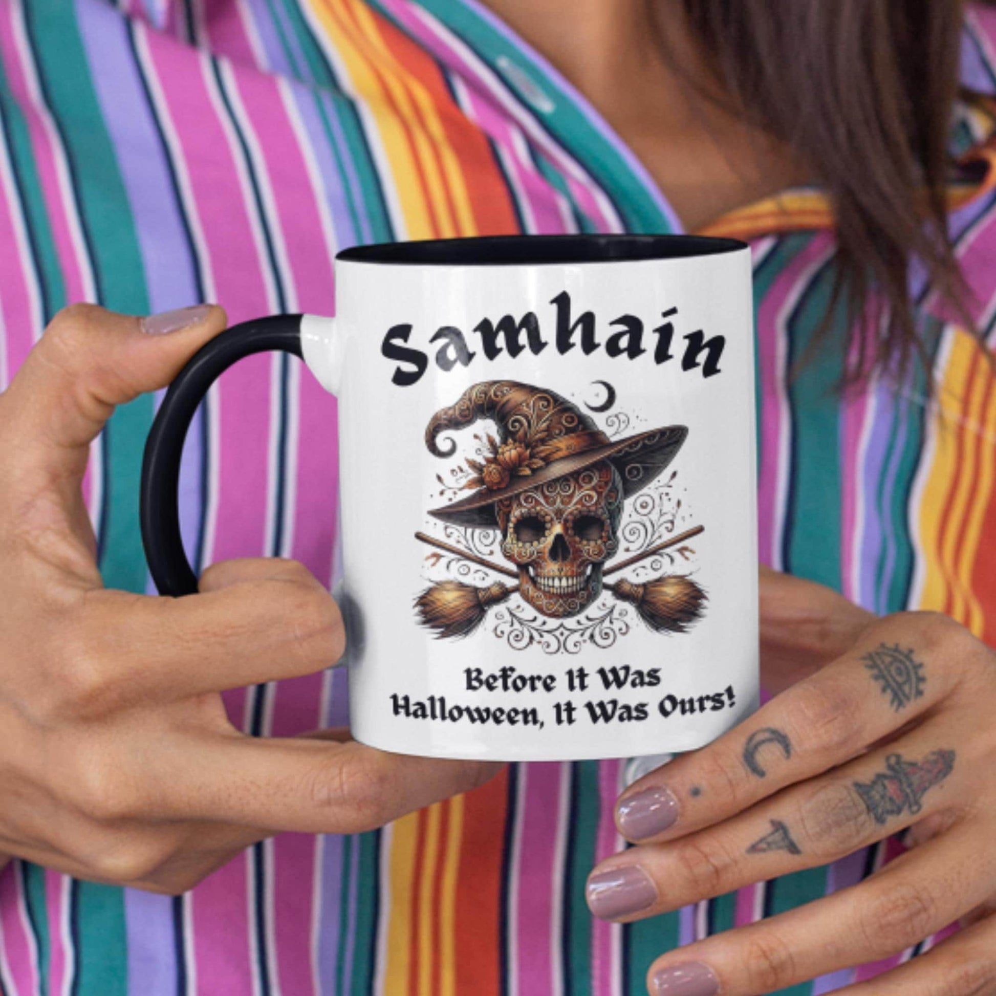 Decorative mug for witches and Wiccans, showcasing a Samhain-themed skull and heraldic broomsticks
