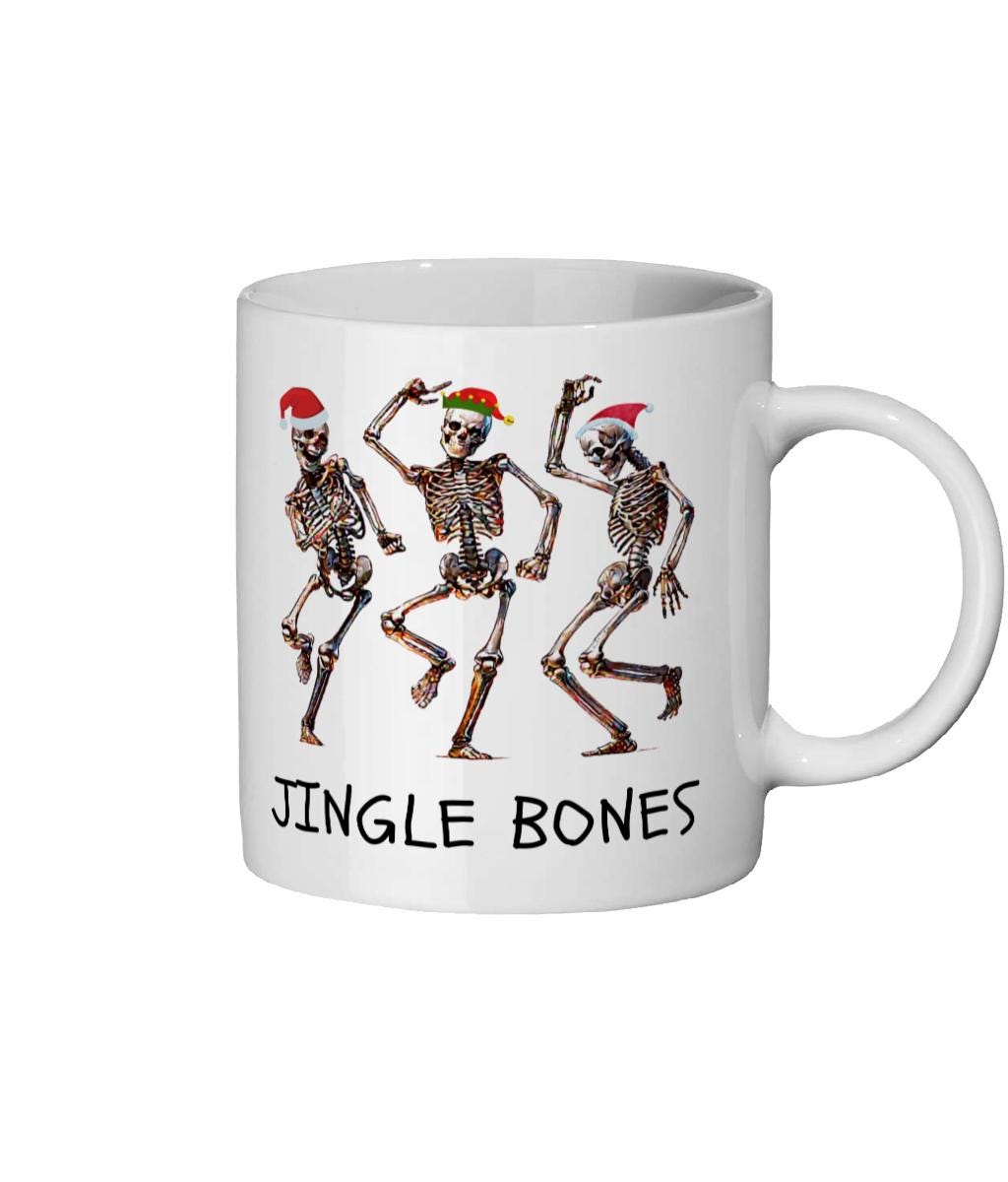 Jingle Bones 11 oz mug featuring skeletons in Christmas hats, perfect for holiday fun
