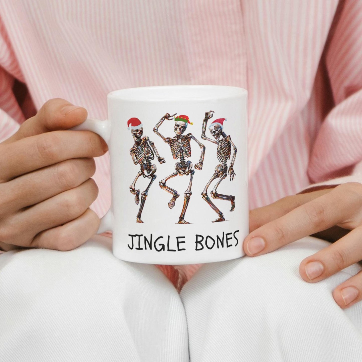 Jingle Bones 11 oz mug with dancing skeletons in holiday hats for Christmas cheer