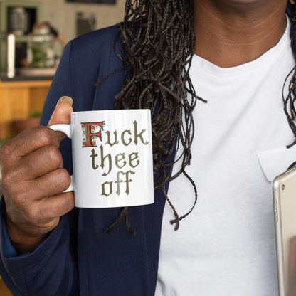 11oz ceramic mug with medieval manuscript-inspired &#39;F*** Thee Off&#39; phrase in decorative Gothic lettering