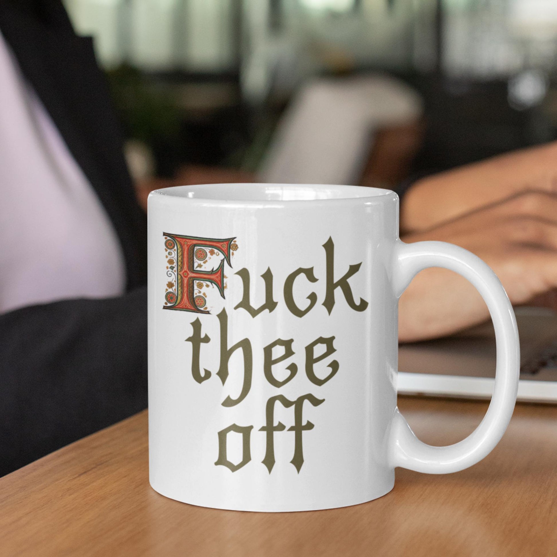 Gothic-style 11oz ceramic mug with the phrase &#39;F*** Thee Off,&#39; perfect for adding some cheeky humour to the office