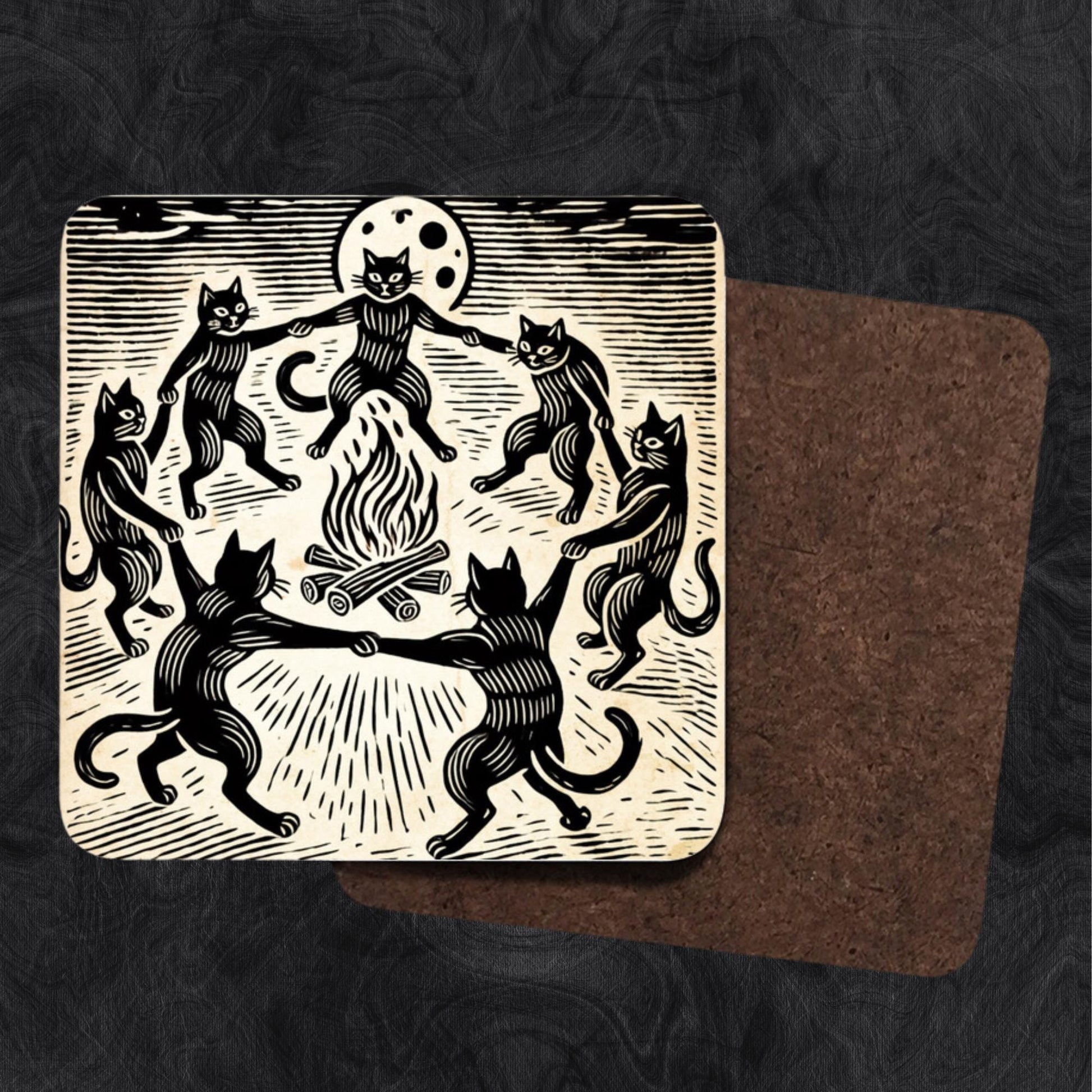 Woodcut-style coasters with black cats holding paws, dancing around a fiery bonfire under a full moon. A must-have for those into witchy, occult, and eerie decor.