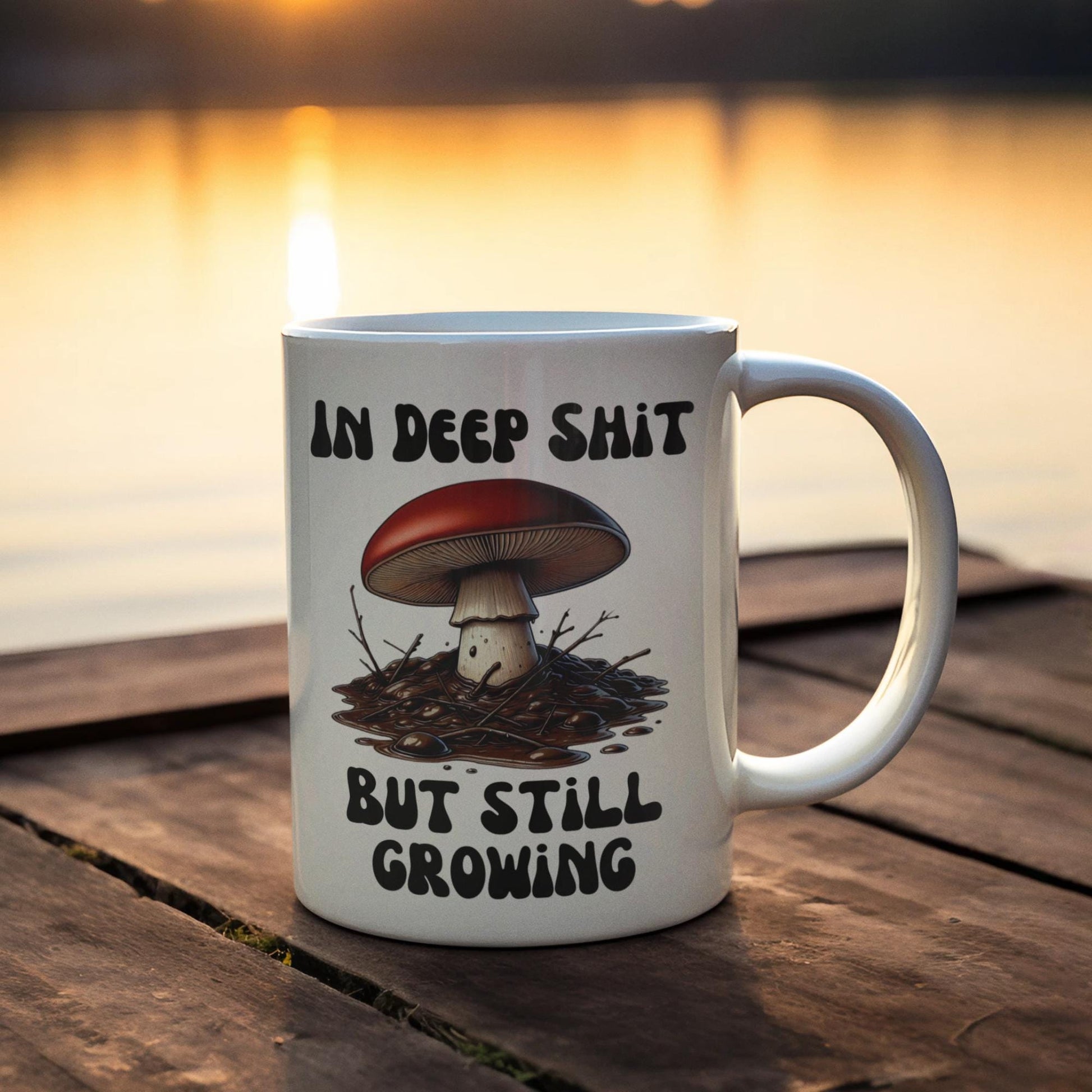 Funny mushroom mug, In Deep Sh*t, But Still Growing, featuring a mushroom in thick mud. Perfect for your daily motivational quote