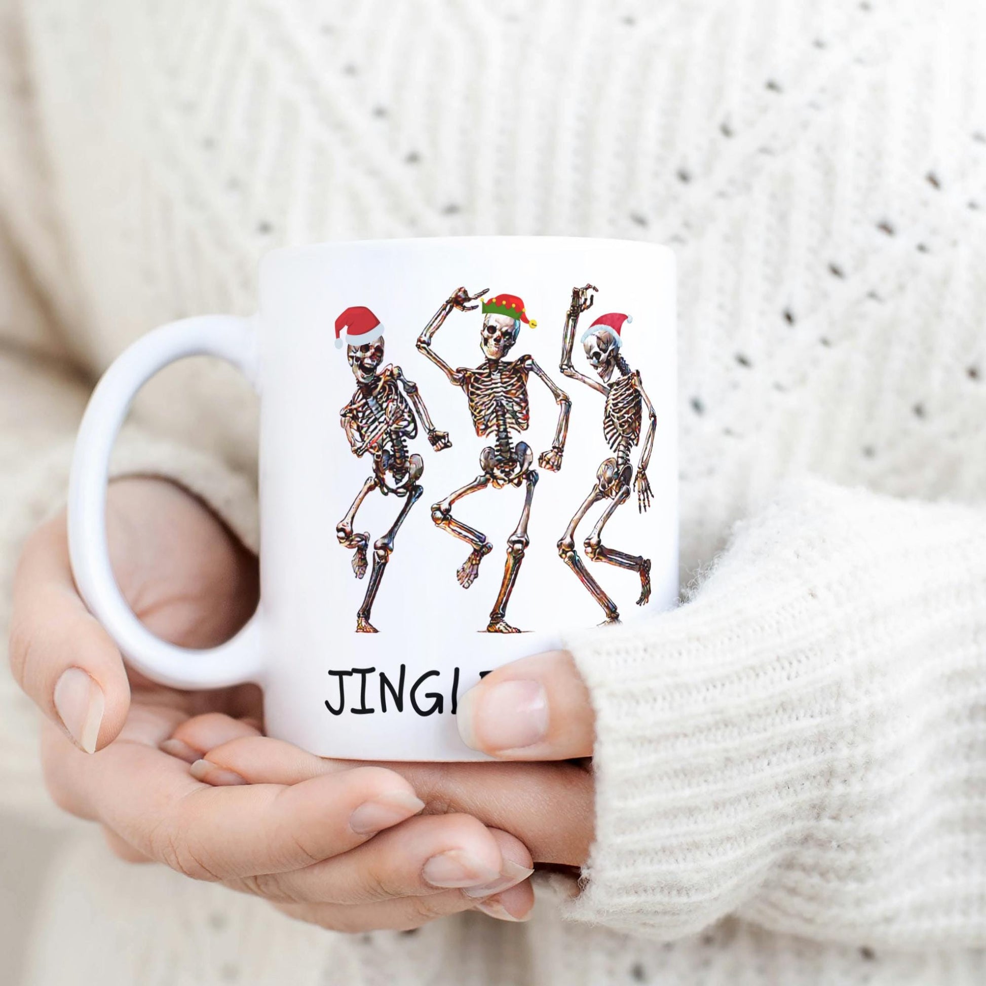 Festive 11 oz mug with dancing skeletons in Santa hats and Jingle Bones text