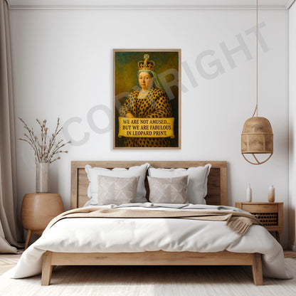 Framed Queen Victoria artwork with bold leopard print, hung as part of a gallery wall arrangement.
