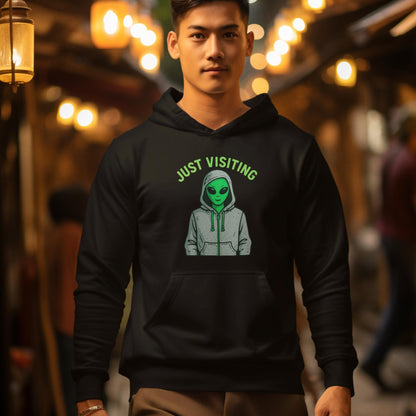 Black alien hoodie with “Just Visiting” graphic for space fans