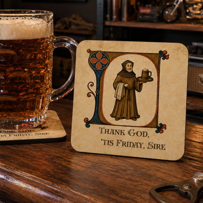 A square beer coaster with a medieval-style illustration of a Franciscan holding a beer mug and the text 'THANK GOD, TIS FRIDAY, SIRE' sits on a wooden bar counter next to a glass of amber beer.