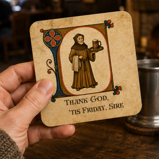 A hand holds a square coaster featuring a medieval-style illustration of a Franciscan monk carrying a tray with a mug, above the text 'THANK GOD, TIS FRIDAY, SIRE'. The background shows a warm, blurred pub interior with a metal mug on a wooden table.
